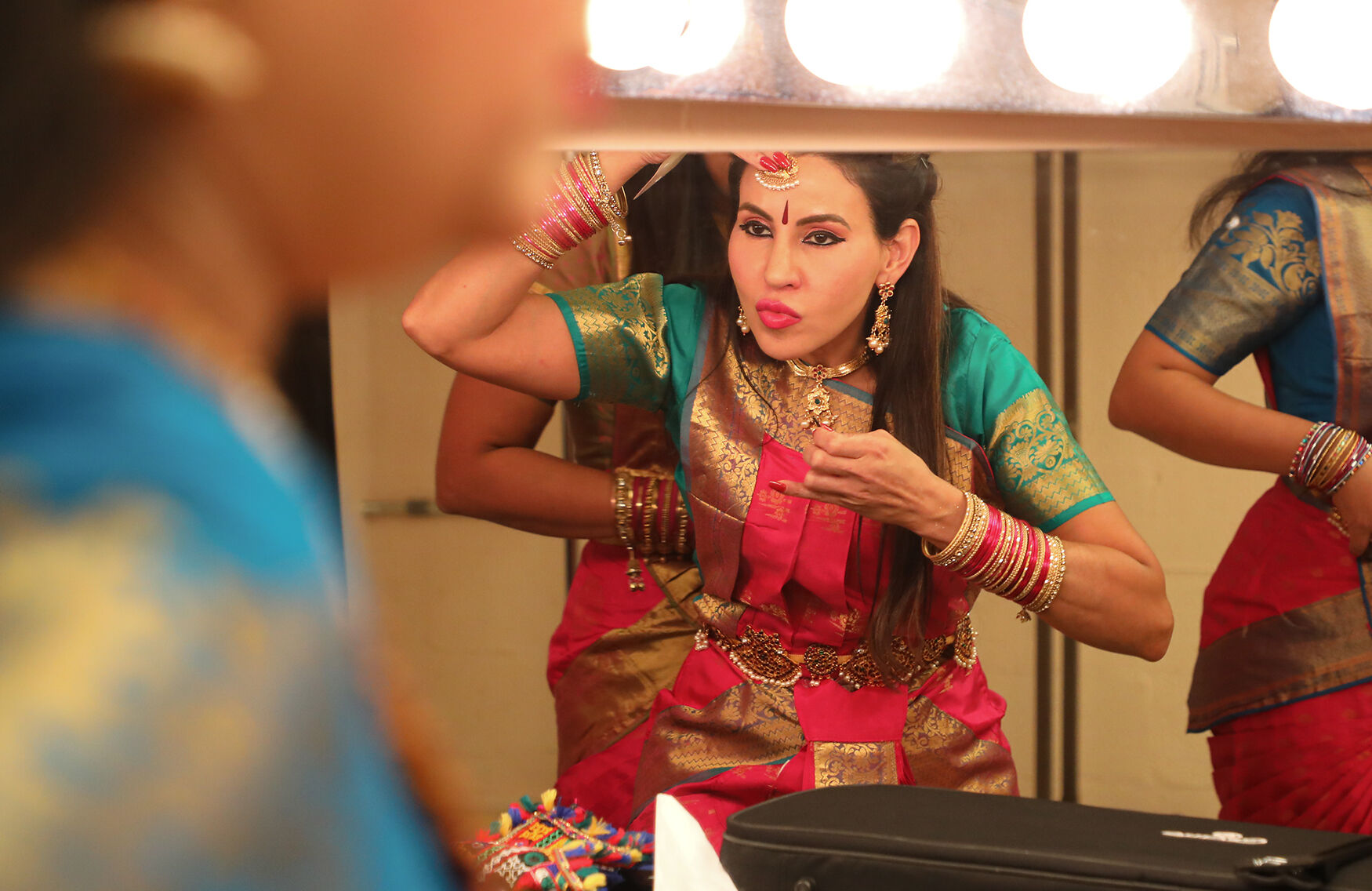 Rachna Puri places a maang tikka on her forehead